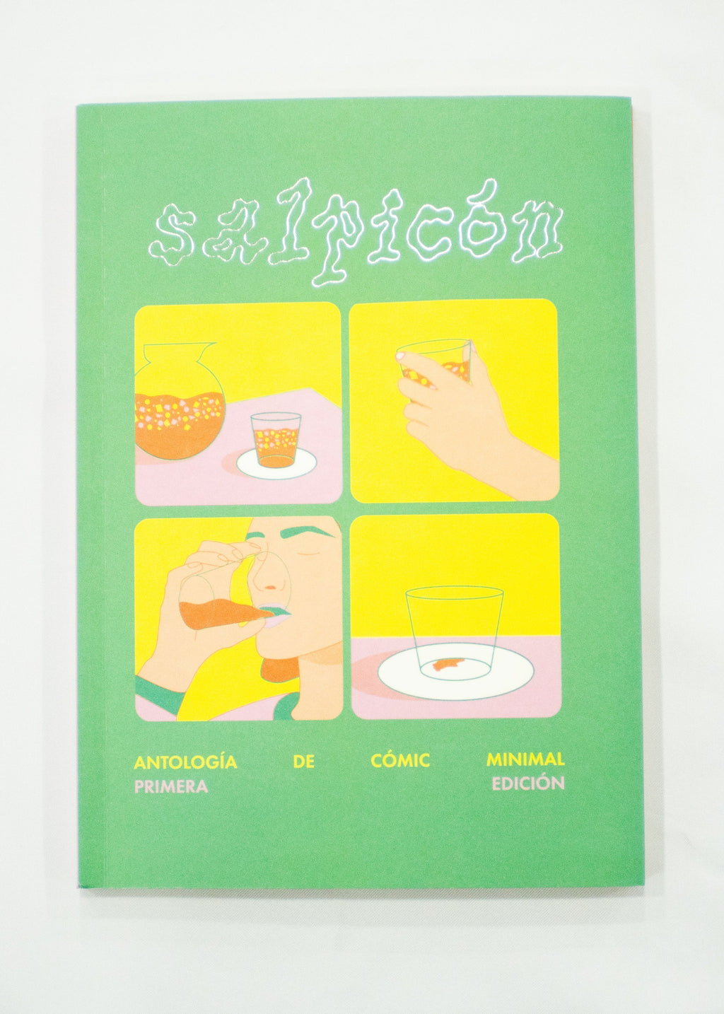 Green book titled 'El Salpicón' with yellow and pink illustrations on a white background